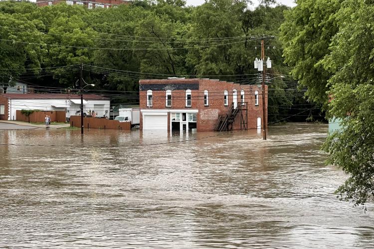 The hitch lot and buildings along South Street were caught off guard as flash flooding hit the area overnight. Photo by Brian Rice.
