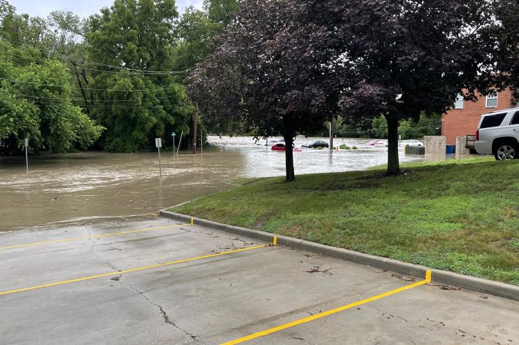 ESPD moved all of their vehicles to higher ground as waters flooded River Street and approached police headquarters Friday morning. Photo by Brian Rice.