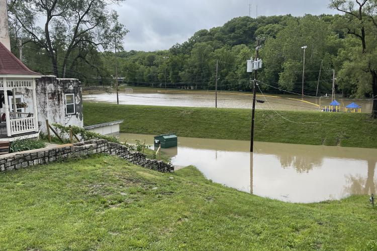 Piburn Field and the roadway behind several downtown businesses, including Willow Spring Mercantile, was completely underwater Friday morning. Photo by Brian Rice.