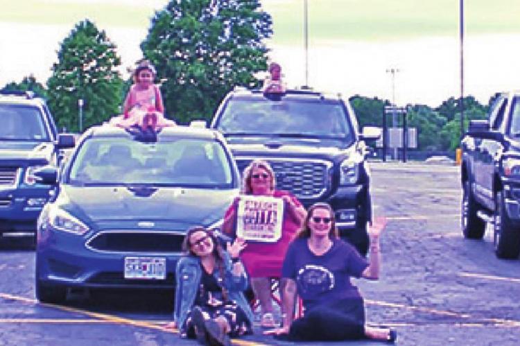 UNABLE TO TAKE a traditional classroom photo due to COVID-19, Noah’s Ark students take a photo in the Noah’s Ark Christian Preschool parking lot.