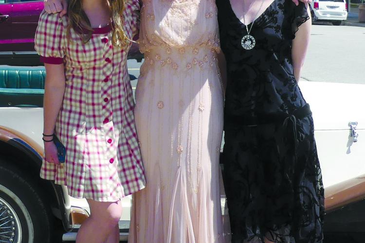 Dressed in the period of Gatsby Days, Addision Vallier (from left), Kennedy Graham and Kellen Graham take in the fun.