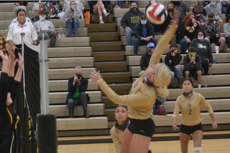 DUSTIN DANNER | Staff JUNIOR RYLI STOTTLEMYRE goes up high to pick up a kill for Excelsior Springs Sept. 8 against visiting Cameron in non-conference action.