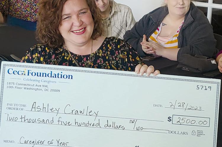 SHARON DONAT | Staff ASHLEY CRAWLEY was also presented with a check as part of her award.