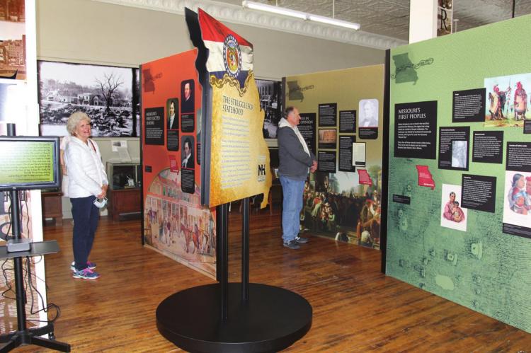 VISITING the “Struggle for Statehood” display at the Excelsior Springs Museum, from left, are Diane Schmidt and her husband, Gary Schmidt. J.C. VENTIMIGLIA | The Standard