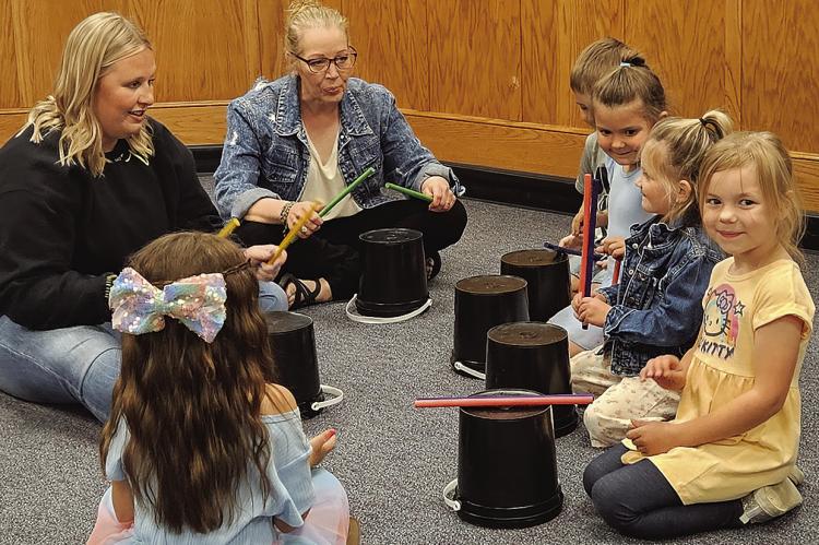 EARLY CHILDHOOD CENTER students show Excelsior Springs School Board members their drumming skills. MIRANDA JAMISON | Staff