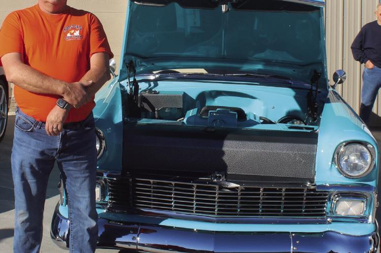 ROOSTERS CLUB member Paul Reed shows off his light blue 1956 Chevrolet. MIRANDA JAMISON | Staff