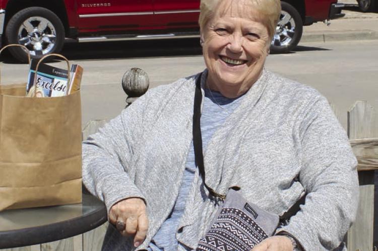 FLORIDA RESIDENT Joyce Messinger enjoys sunshine during a break from shopping.