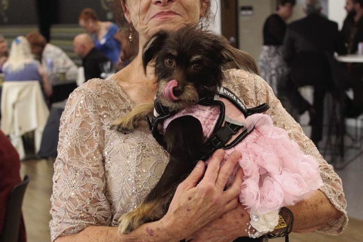 FRANCESCA CROSBY brings her dog, Zoey, to participate in the Silver Prom festivities.