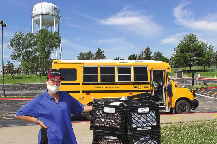 RACHEL BROWN is ready to load food onto buses for delivery to district students. J.C. VENTIMIGLIA | Staff