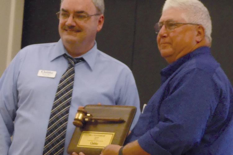 BRIAN RICE (left) acknowledges Bill Westerheide with a plaque for his years of service. ELIZABETH BARNT | Staff