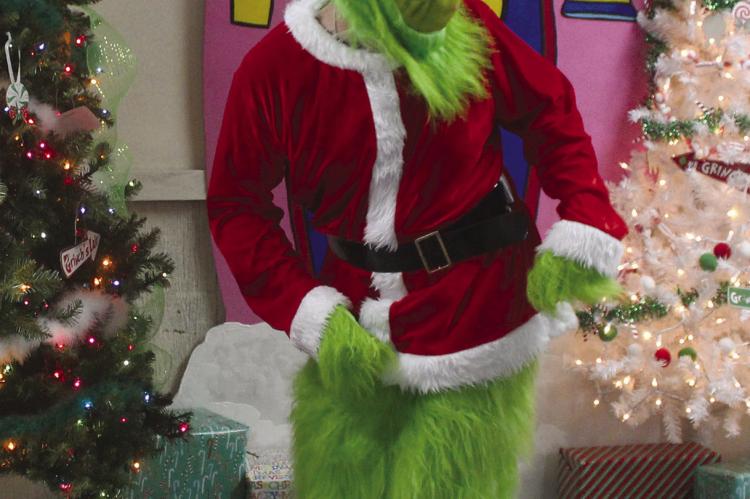 THE GRINCH was up to his usual shenanigans while at Wild Bunch’s Holiday Open House.