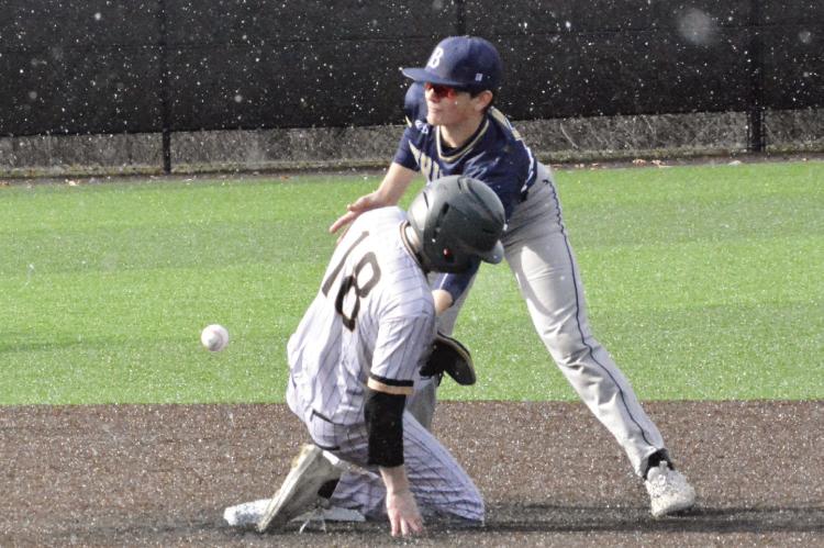 LUCAS DILLMAN beats the throw to second, resulting in a stolen base and putting him in scoring position March 17 against visiting William Chrisman.