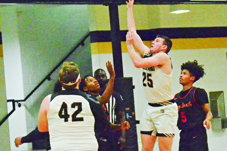 JUNIOR EASTON RYAN puts up a floater for two points during Excelsior Springs’ Feb. 9 loss to Raytown South in varsity boys basketball. DUSTIN DANNER | Staff