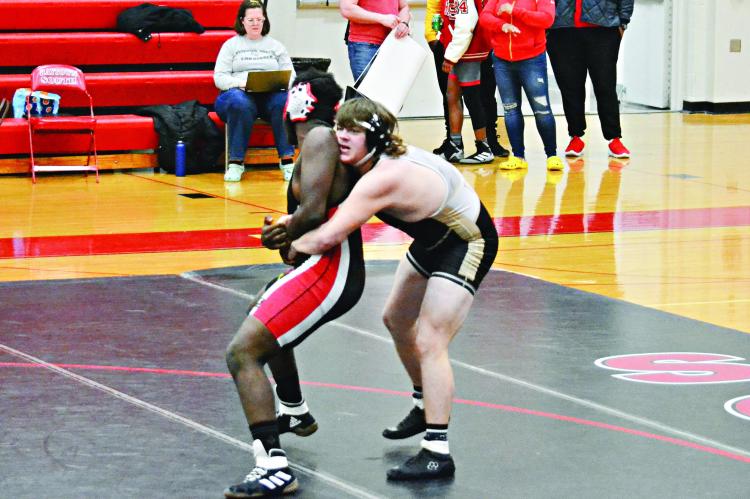 EXCELSIOR SPRINGS junior Lane Crowley, right, controls his opponent prior to scoring a takedown and getting a victory by pin during the Tigers’ 65-15 Feb. 1 road dual win over Raytown South. DUSTIN DANNER | Staff