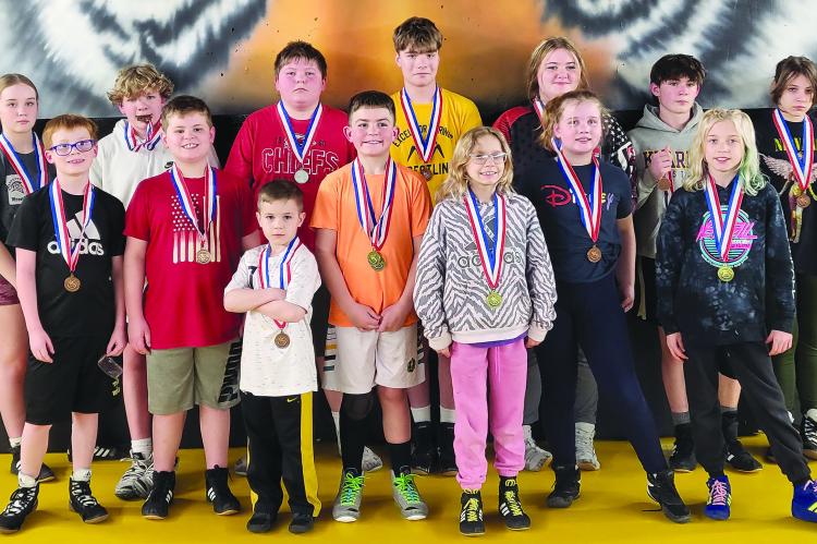 MEMBERS OF the Excelsior Springs Youth Wrestling Club proudly display their district medals. SHARON DONAT | Staff