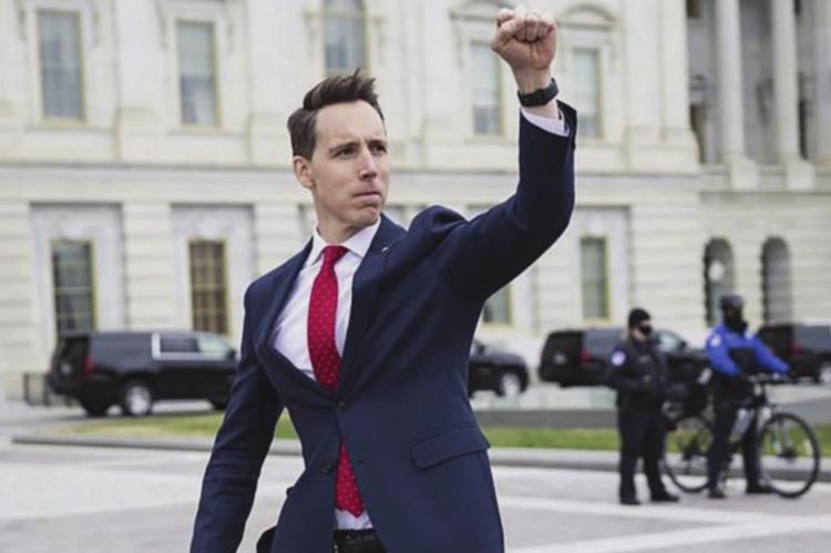 U.S. SEN. Josh Hawley raises his fist in support of the crowd that gathers in protest of the presidential election outcome, which Hawley questions. FRANCIS CHUNG | E&amp;E News/Politico