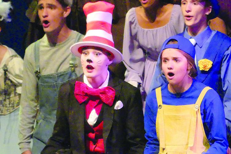 PORTRAYING DR. SEUSS characters Mac Morris (left), Em Rice as the Cat in the Hat and Abby Rash sing in the Excelsior Springs High School production of “Seussical the Musical.” ELIZABETH BARNT | Staff