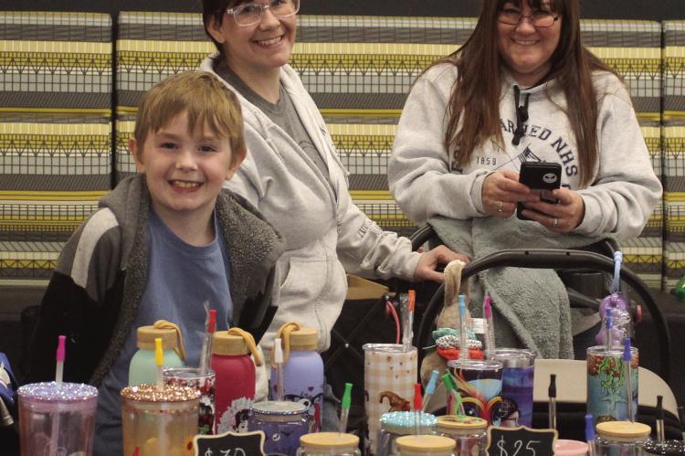 JENSEN POLLEY (from left), Adrianne White and Delise Fisher with Nerd on Craft Street, participated as vendors in Holly Days at ESHS. MIRANDA JAMISON | Staff