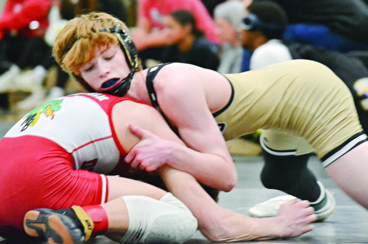 COOPER COLLINS, shown in control of his opponent, looks to repeat as a state champion for Excelsior Springs this season. DUSTIN DANNER | Staff