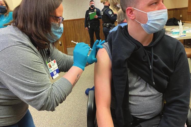 POLICE OFFICER Ryan Dowdy is one of the first emergency responders to receive the vaccine at the Excelsior Springs Hospital’s COVID vaccination site. COURTNEY COLE | Special to the News Standard