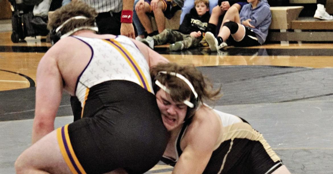 EXCELSIOR SPRINGS JUNIOR Lane Crowley, right, reaches for a single leg during his 215-pound match with Jase Jackson as the Tigers face Kearney in a Jan. 11 home dual. DUSTIN DANNER | Staff