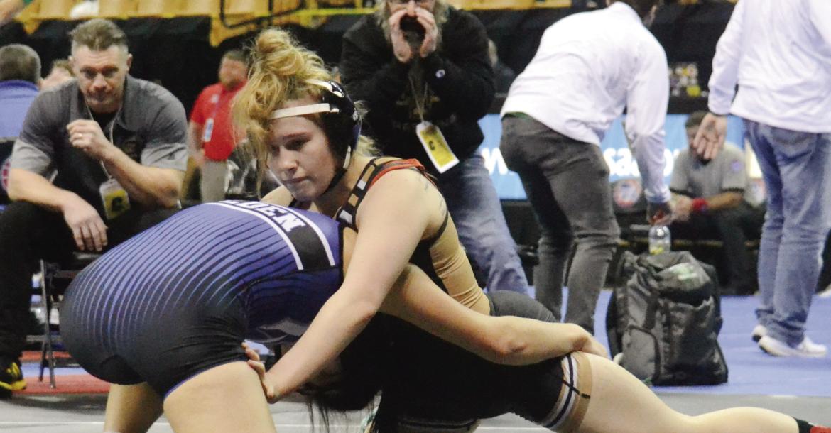 EXCELSIOR SPRINGS senior Vada Burton, right, grapples during the Class 1 state girls tournament, held Feb. 22-23 at Mizzou Arena in Columbia. DUSTIN DANNER | Staff